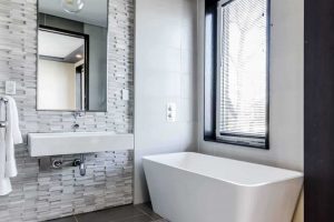 bathroom remodel with tile accent walls